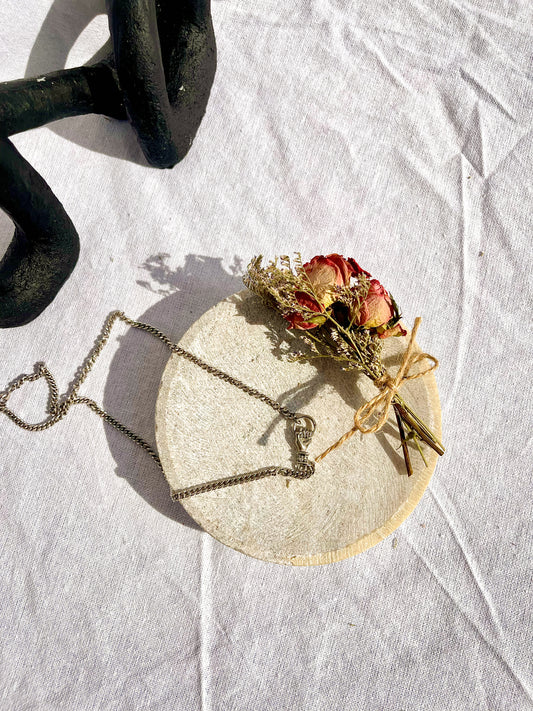 Silver Hand Holding Necklace